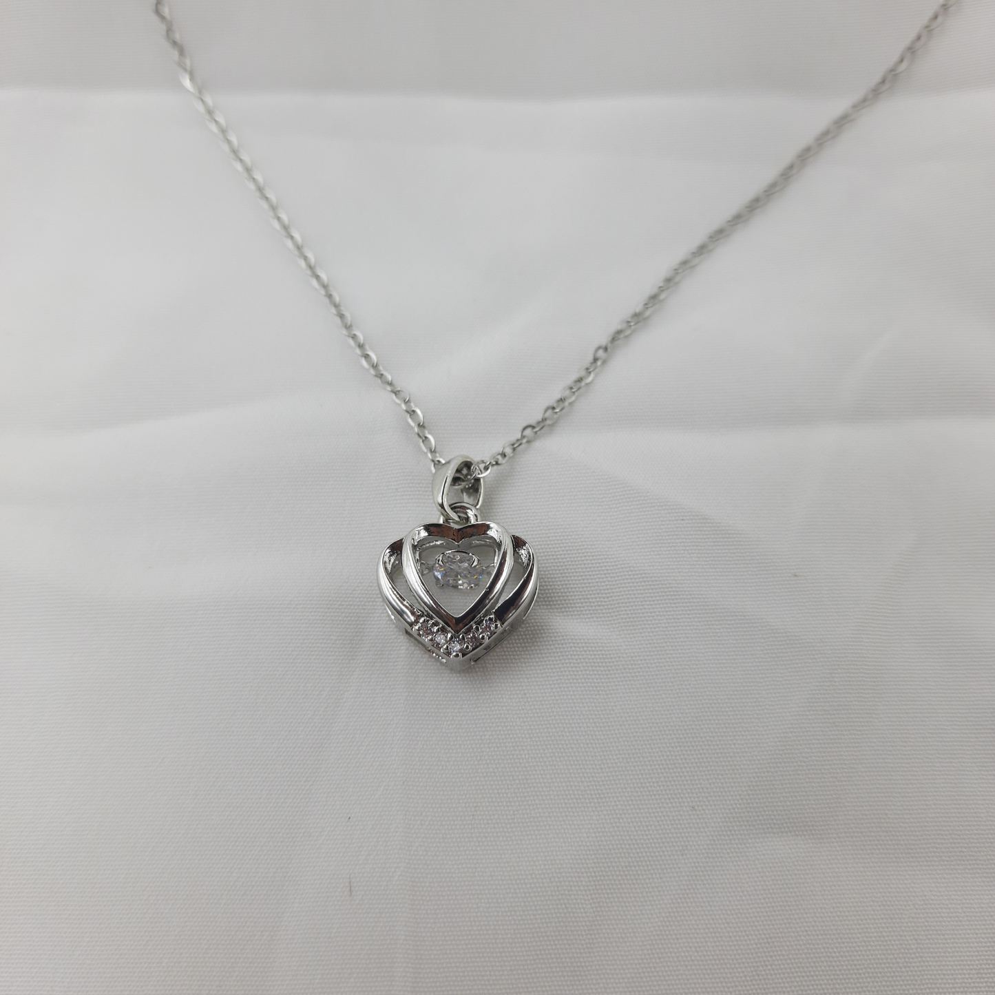 HEART PENDANT WITH SPARKLING CENTER STONE