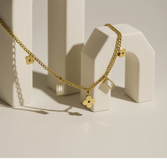 GOLD PLATED FLORAL & CRUSTAL CHARM NECKLACE